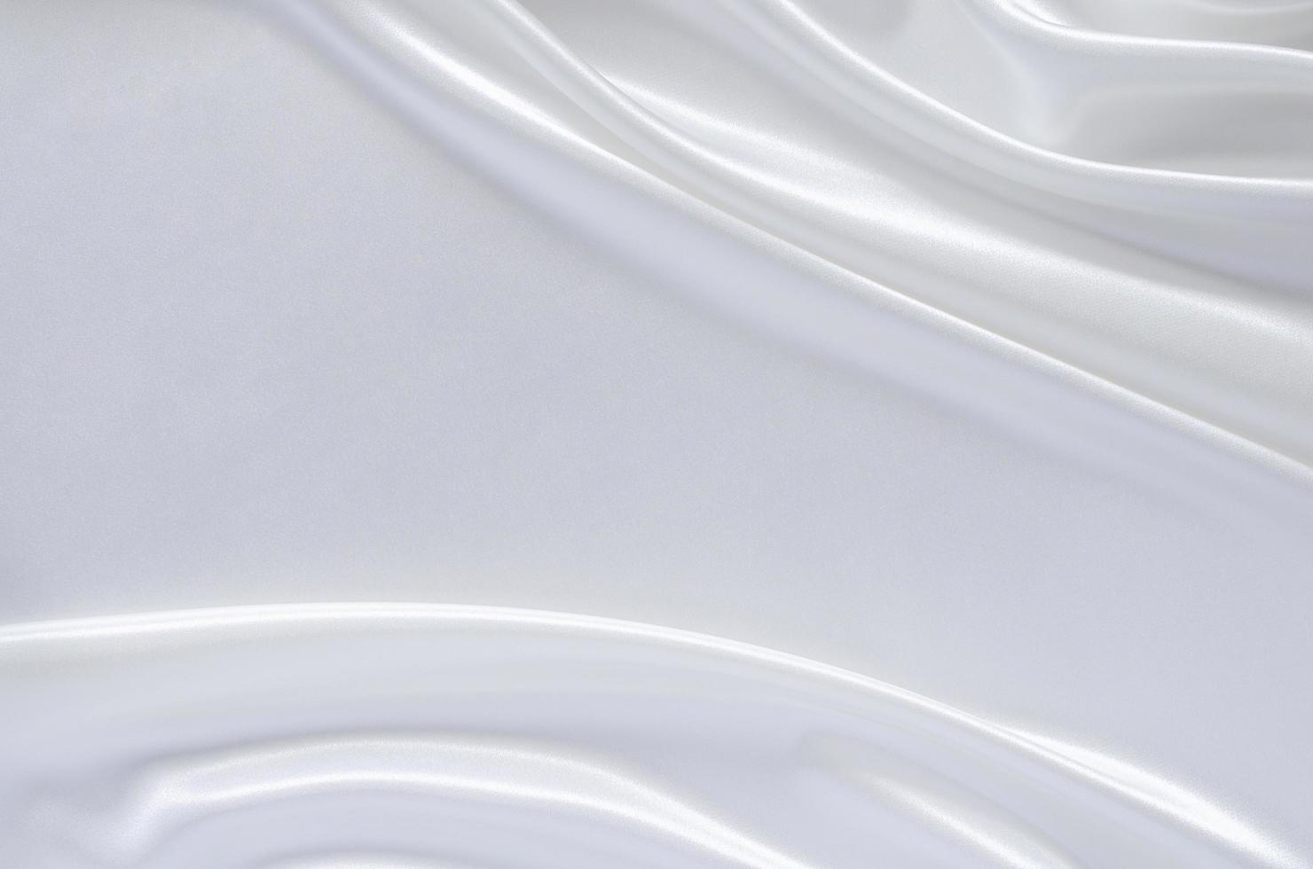 Elegant wavy and smooth white satin cloth texture background. photo