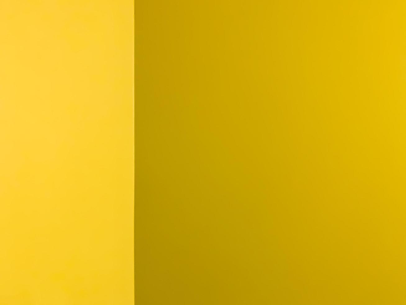 Background and texture of the corner of yellow wall. photo