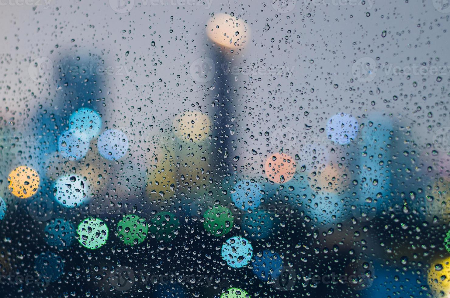 Rain drop on glass window in monsoon season photo