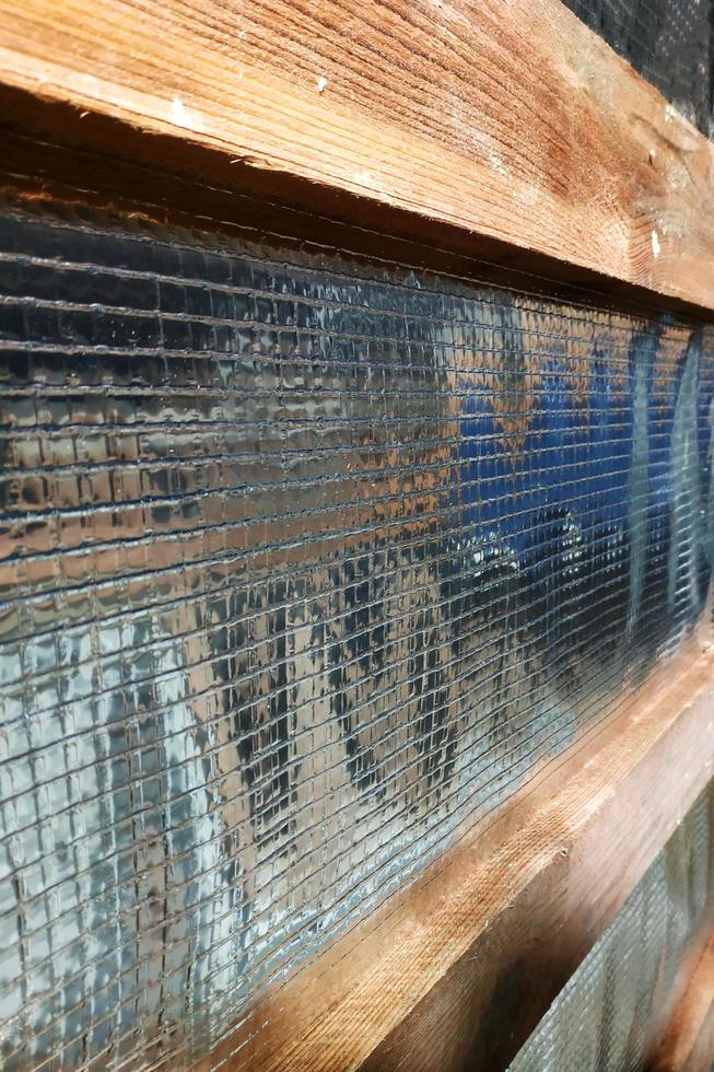 Insulation of the roof of the house on the inside with the use of a wrapper film and fixing boards photo