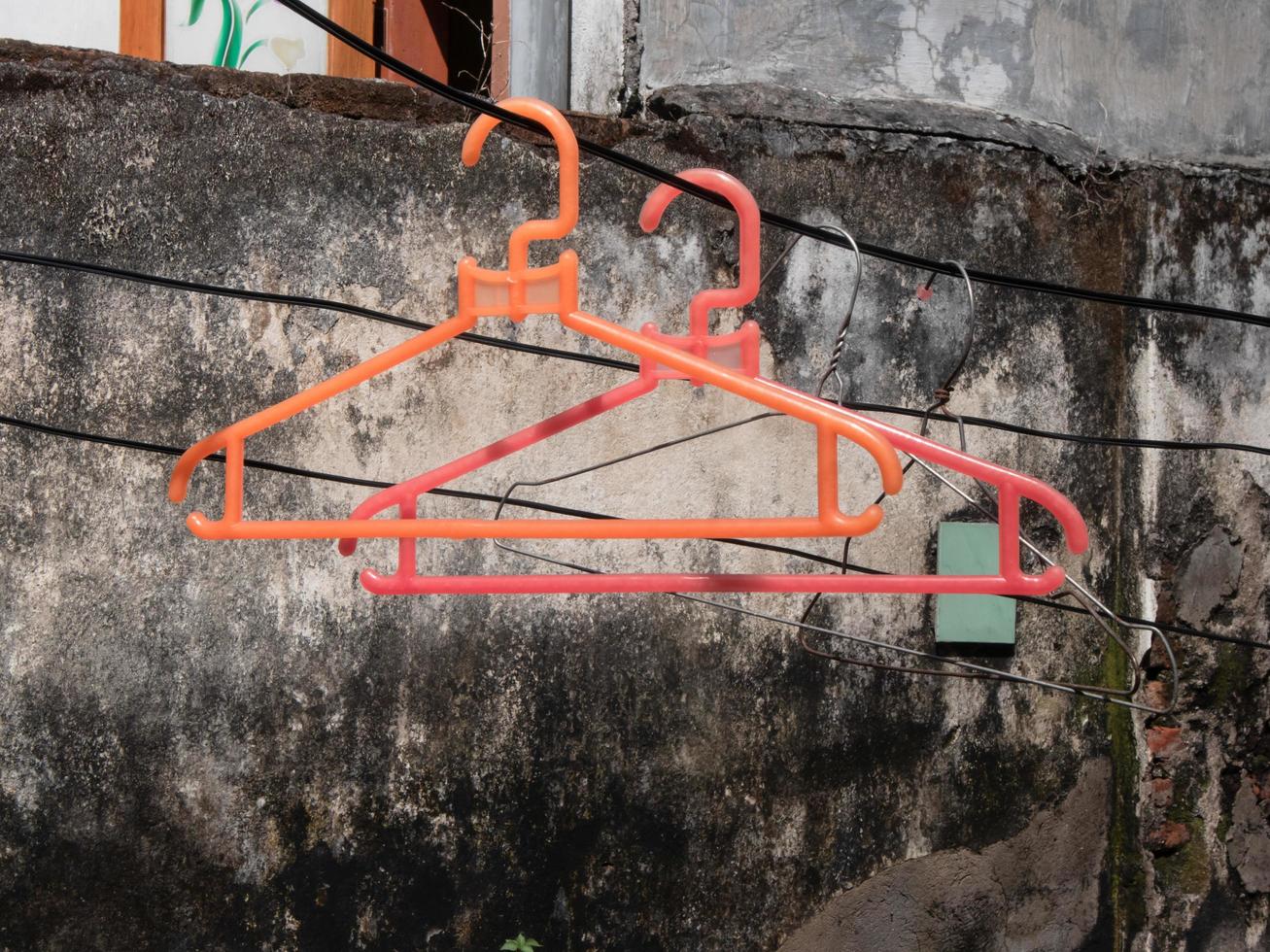 clothes hanger hanging on the outside clothesline photo