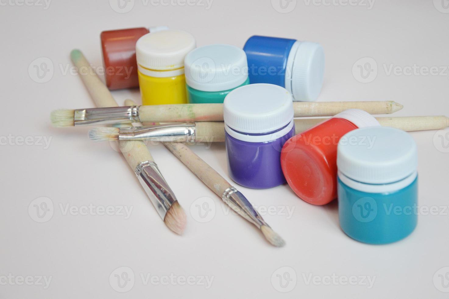 wooden art palette with paint and brushes, close up 17656677 Stock Photo at  Vecteezy