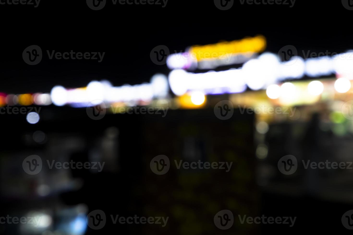 Abstract bokeh light effects on the night. Black background with colorful light effects. background with  Blur bokeh effects. Abstract background texture photo