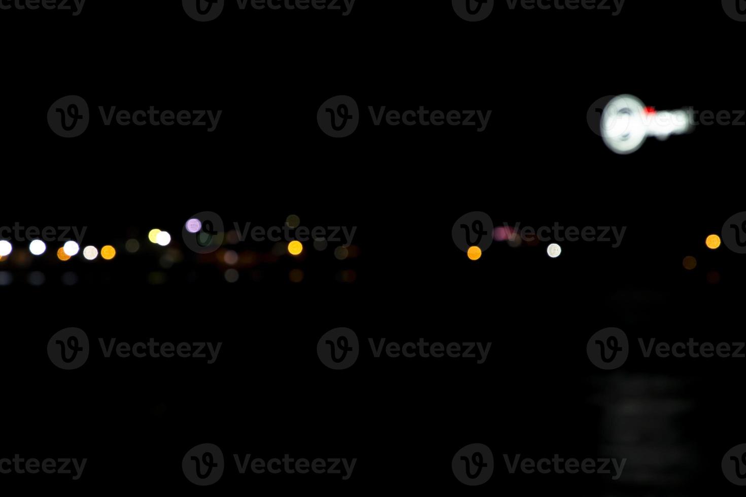 Abstract bokeh light effects on the night. Black background with colorful light effects. background with  Blur bokeh effects. Abstract background texture photo