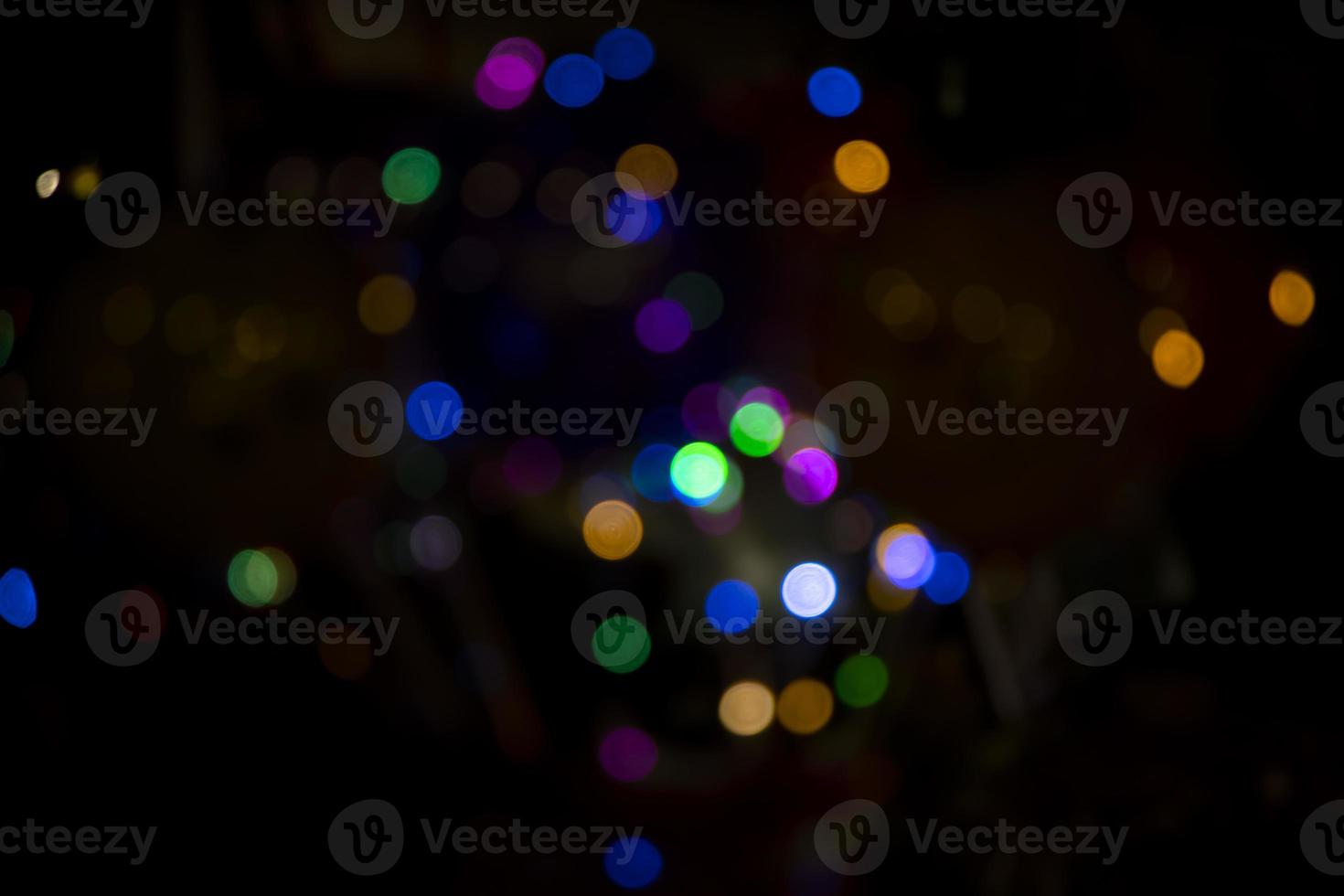 Abstract bokeh light effects on the night. Black background with colorful light effects. background with  Blur bokeh effects. Abstract background texture photo