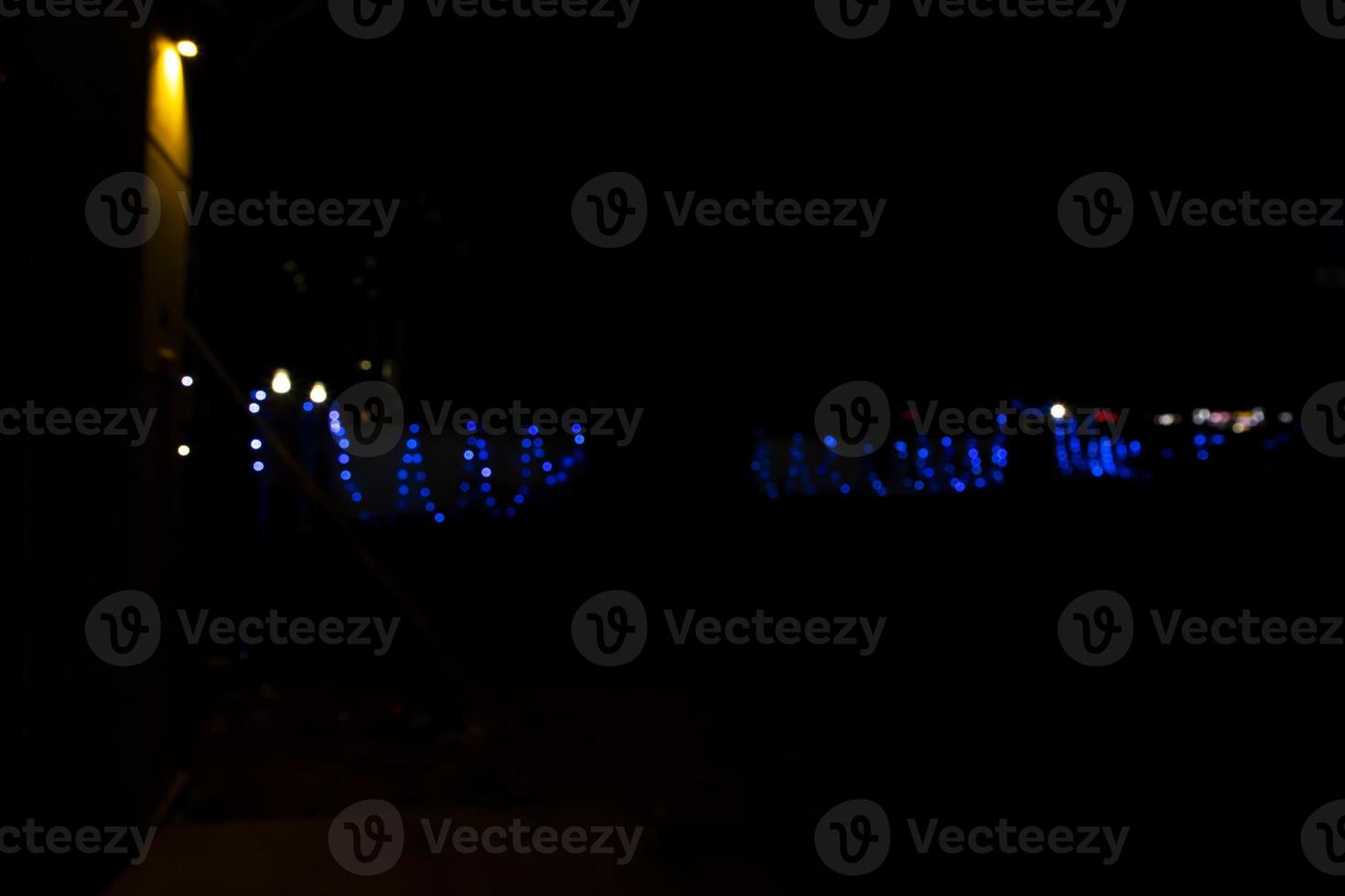 Abstract bokeh light effects on the night. Black background with colorful light effects. background with  Blur bokeh effects. Abstract background texture photo