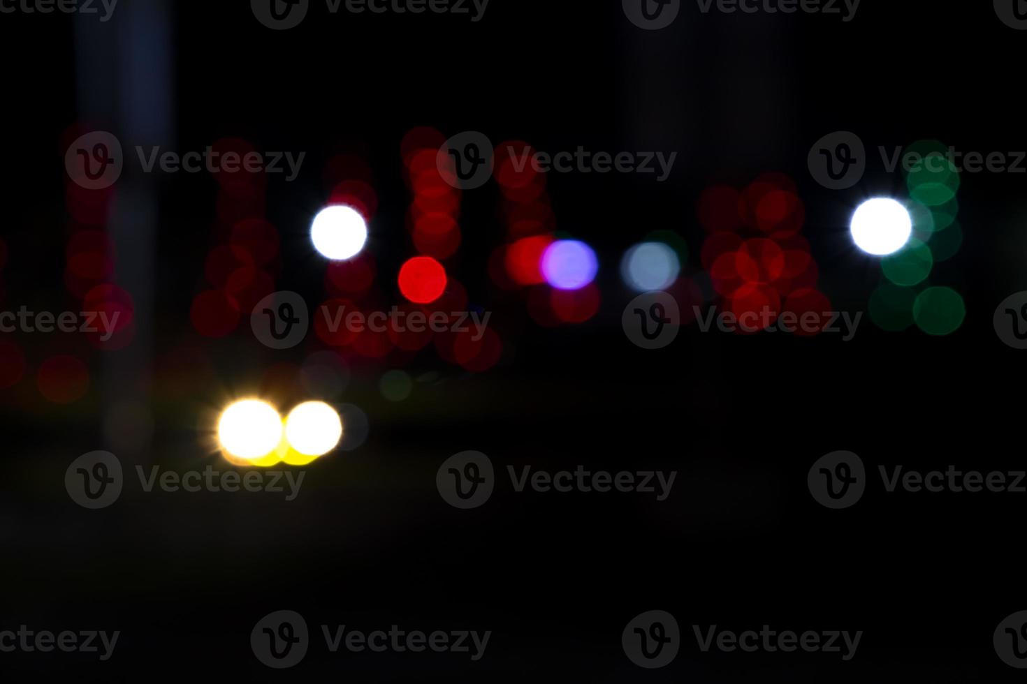 Abstract bokeh light effects on the night. Black background with colorful light effects. background with  Blur bokeh effects. Abstract background texture photo