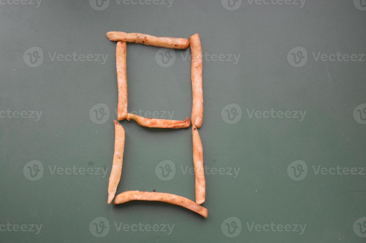 Letters of the english alphabet laid out from french fries photo