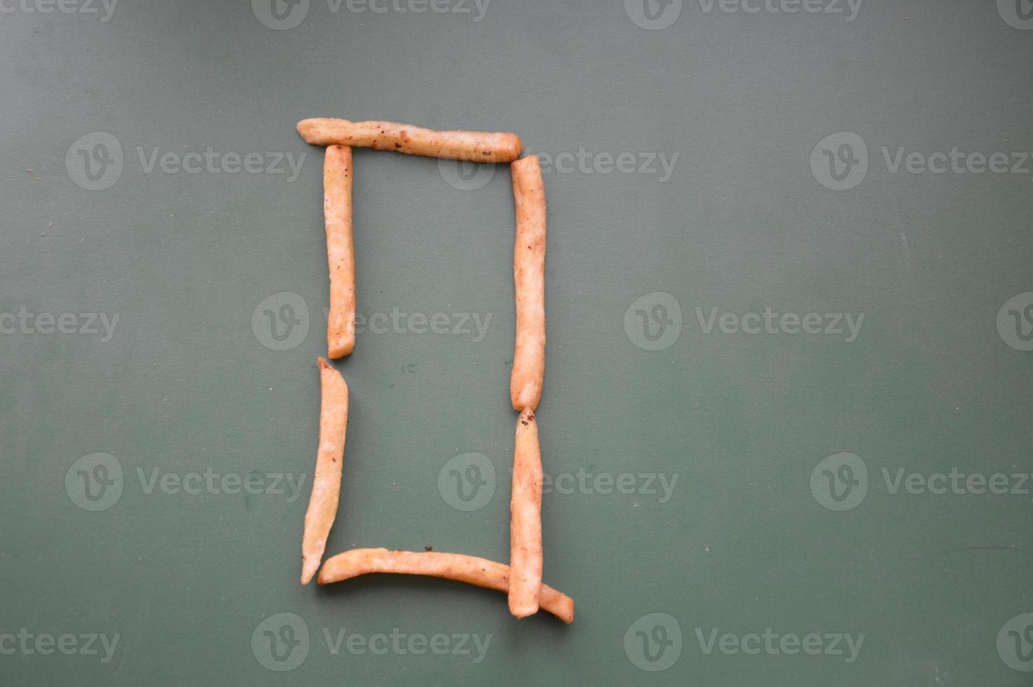 Letters of the english alphabet laid out from french fries photo