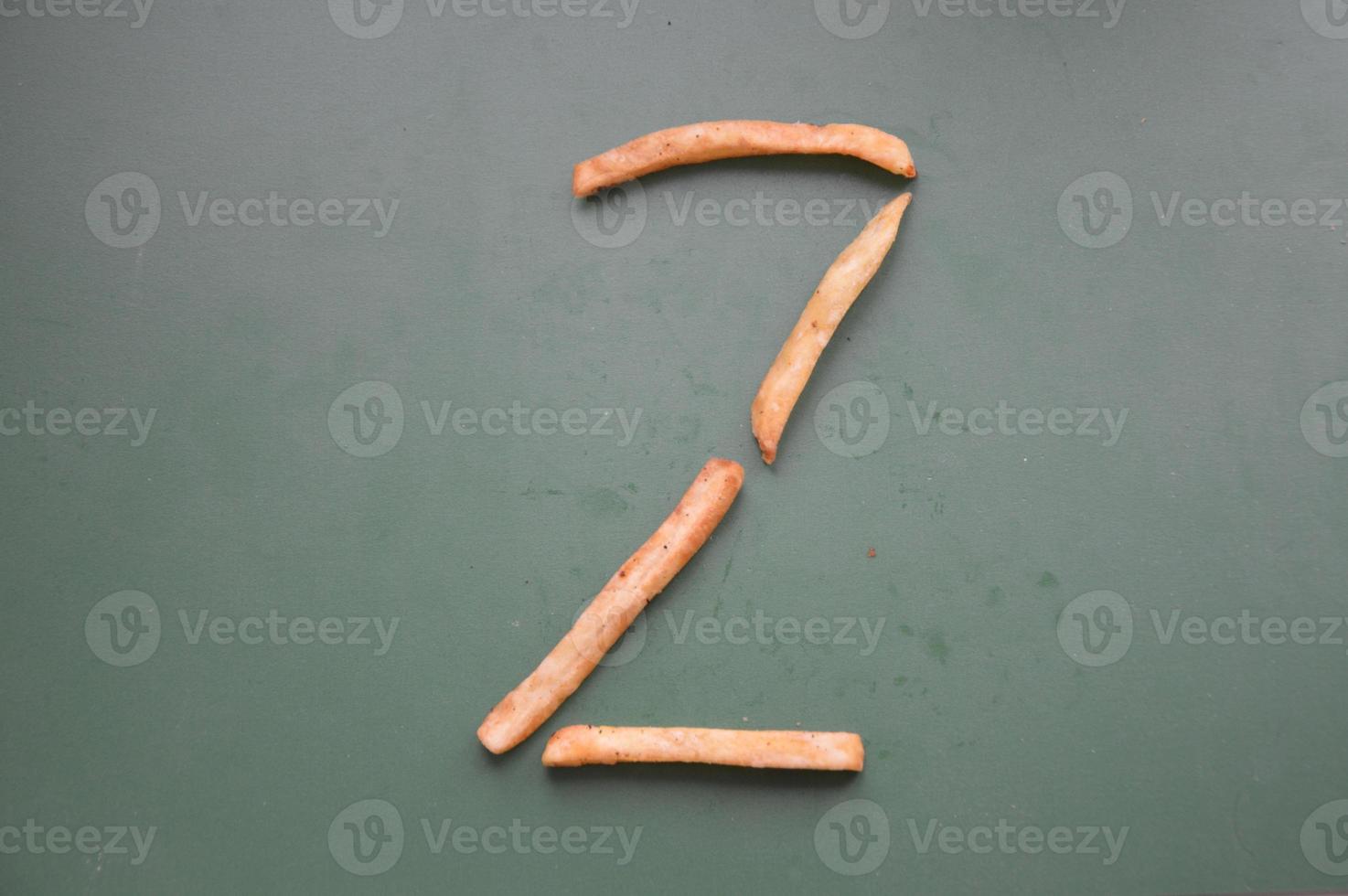 Letters of the english alphabet laid out from french fries photo