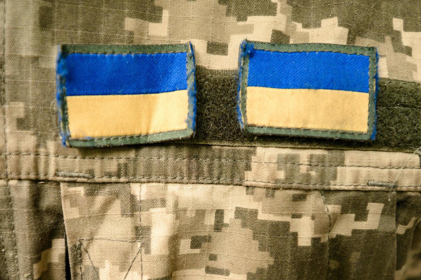 Chevrons on the Ukrainian military pixel uniform. photo