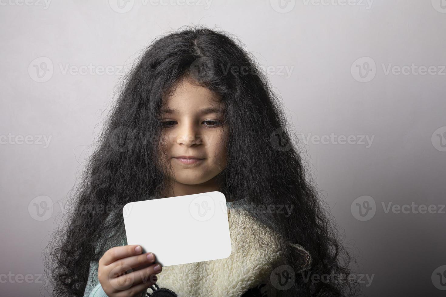 Little girl portrait looking at flash card mock-up series photo