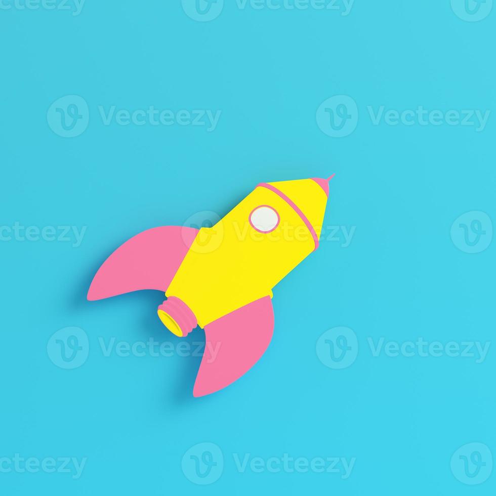 Yellow cartoon styled rocket on bright blue background in pastel colors photo
