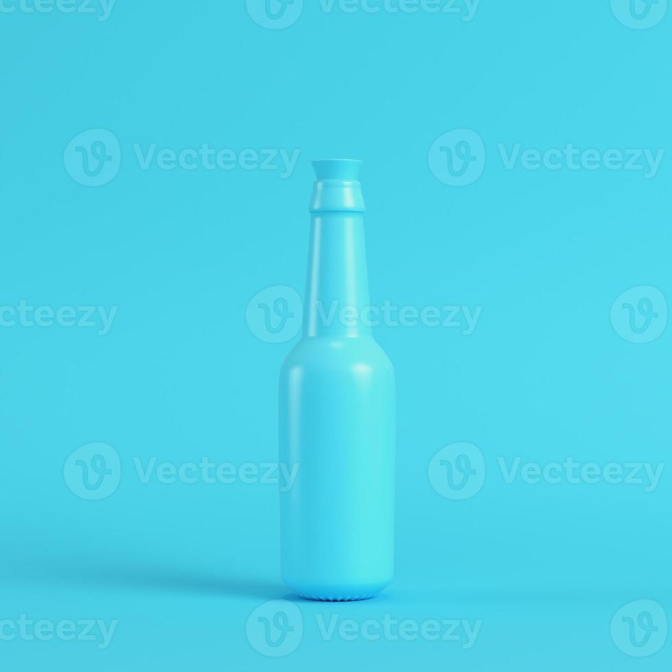 Blank bottle with stopper on bright blue background in pastel colors photo