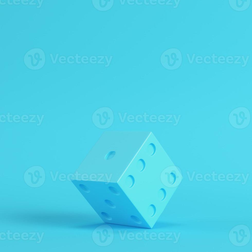 Dice on bright blue background in pastel colors. Minimalism concept photo