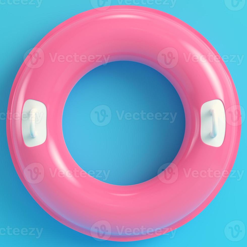anillo inflable rosa sobre fondo azul brillante en colores pastel foto