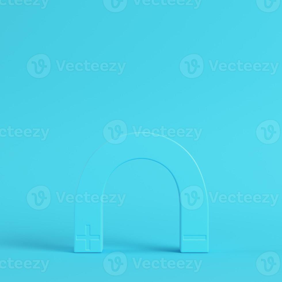 Magnet on bright blue background in pastel colors photo