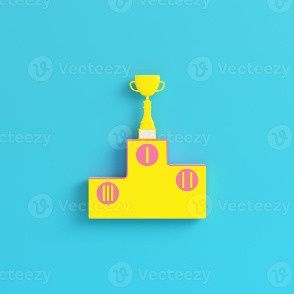 Yellow pedestal with trophy cup on bright blue background in pastel colors. Minimalism concept photo