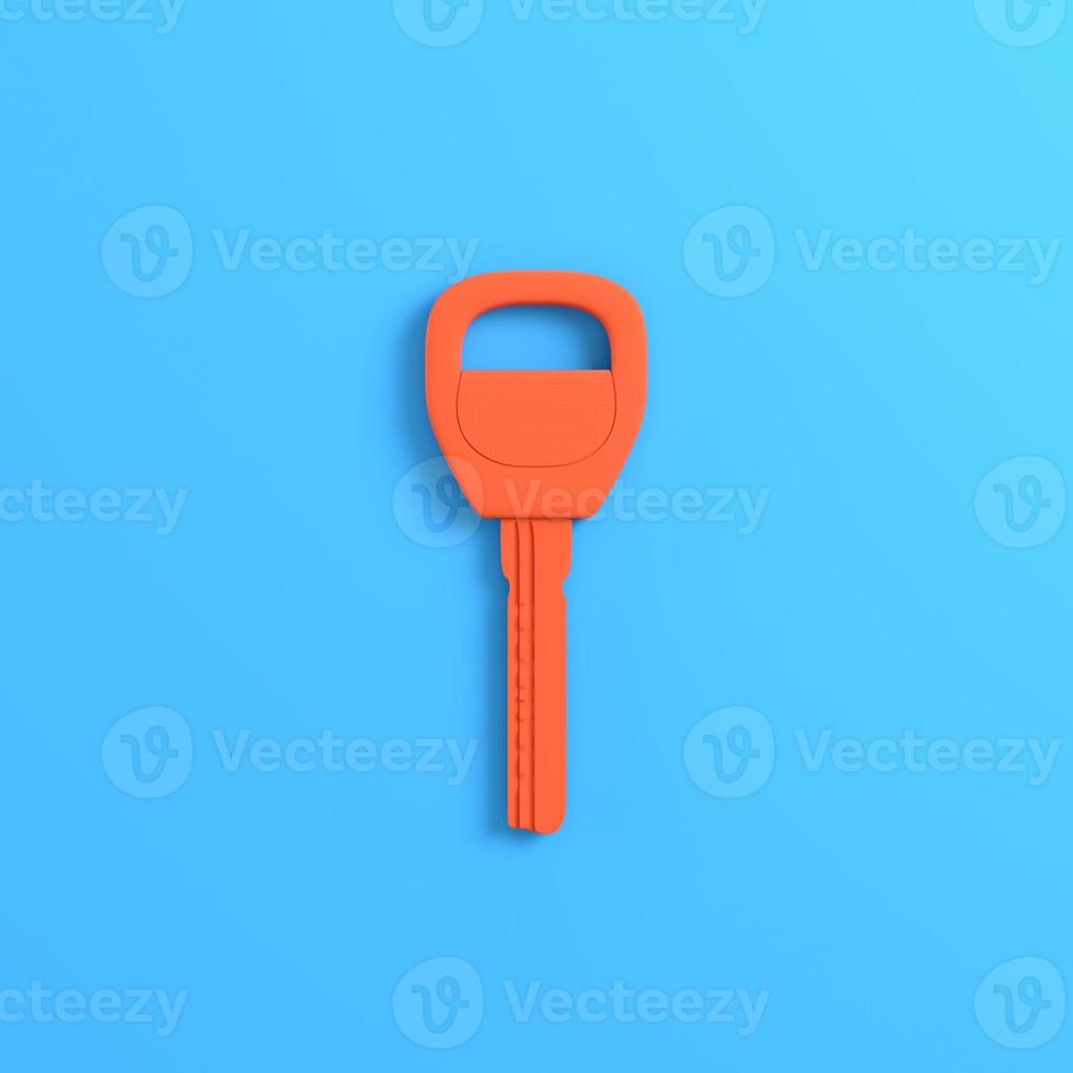 Home or car key on bright blue background photo