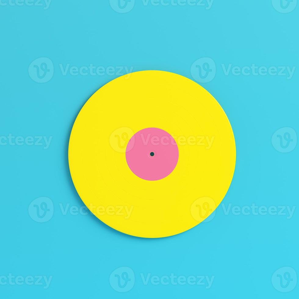 Yellow vinyl record on bright blue background in pastel colors. Minimalism concept photo