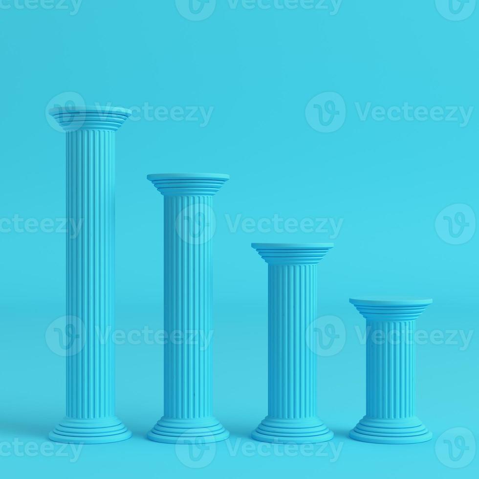 Four ancient pillars on bright blue background in pastel colors photo