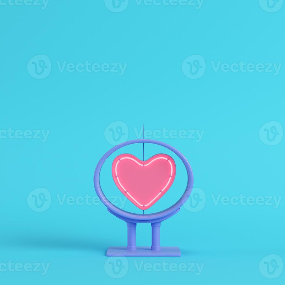 Neon heart shape in frame on bright blue background in pastel colors photo