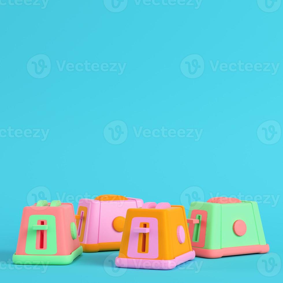 Four colorful toasters on bright blue background in pastel colors. Minimalism concept photo