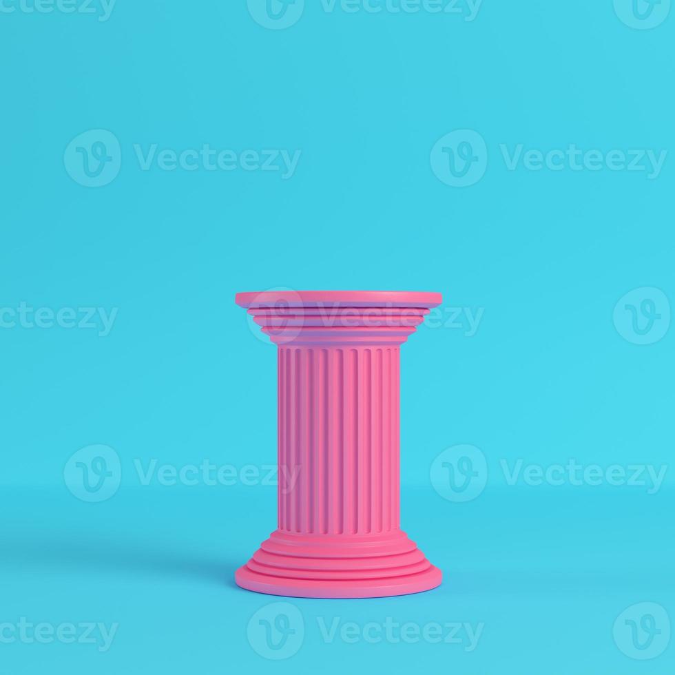 Pink ancient pillar on bright blue background in pastel colors photo