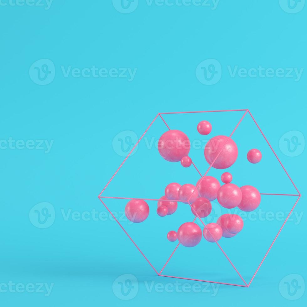 Abstract spheres in wire box on bright blue background in pastel colors. Minimalism concept photo