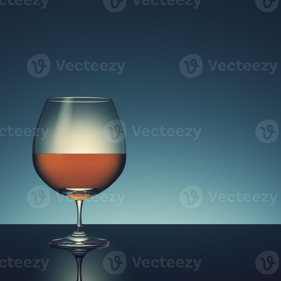 Glass with alcohol on dark background. photo