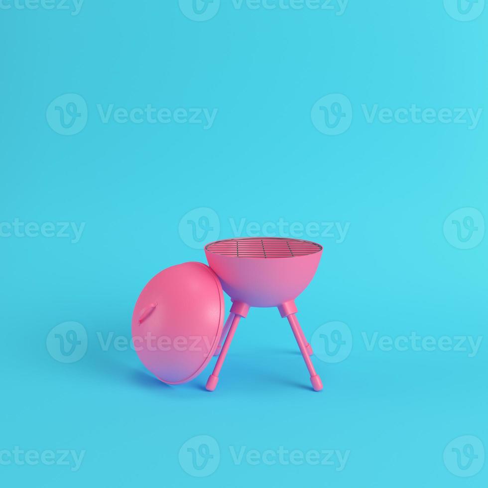 Charcoal kettle barbecue grill on bright blue background in pastel colors photo