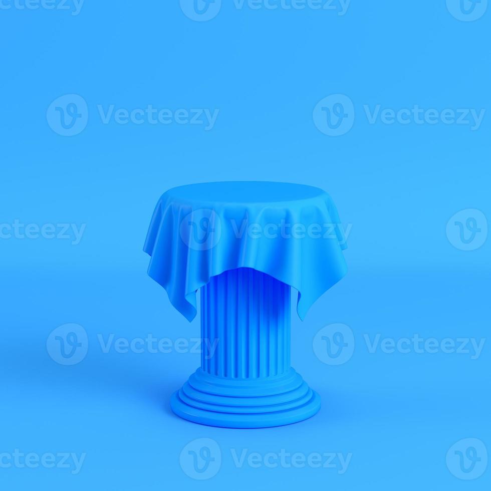 Cloth on a pedestal on bright blue background photo