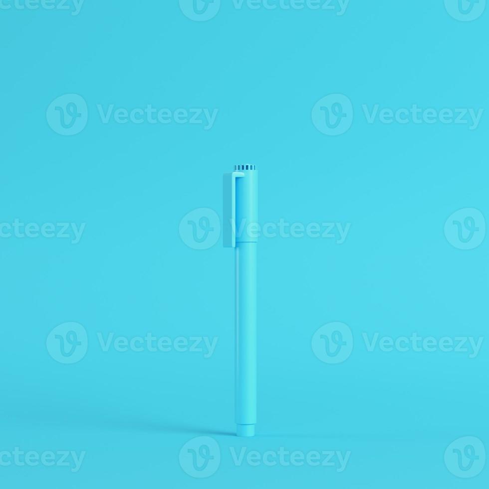 Marker pen on bright blue background in pastel colors. Minimalism concept photo