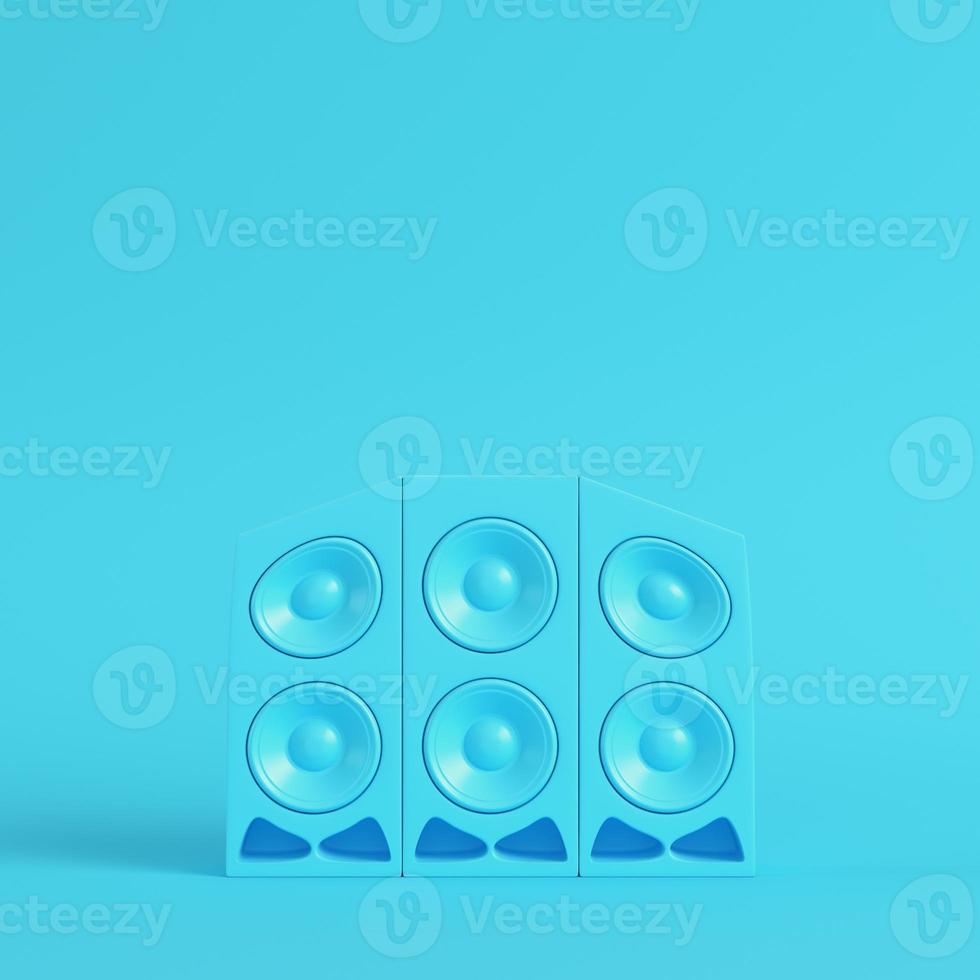 Stereo cartoon-styled speakers on bright blue background in pastel colors photo