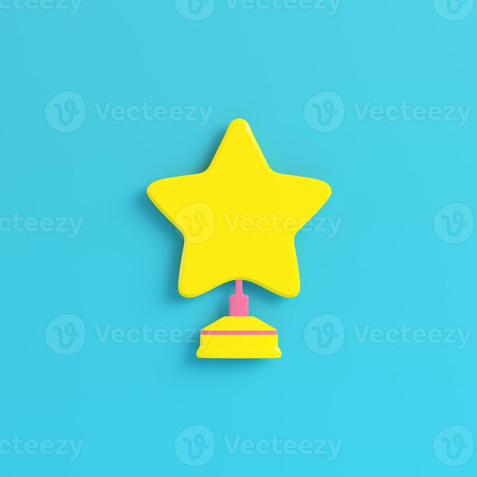 Yellow star with stand on bright blue background in pastel colors. Minimalism concept photo