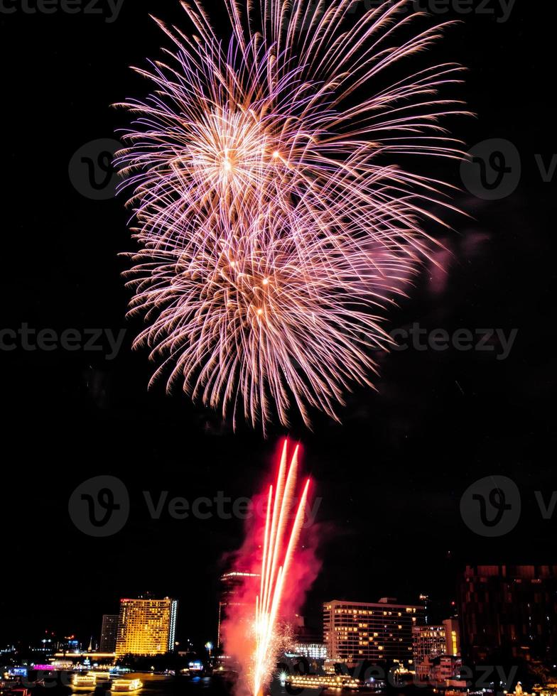 fireworks on the river in the dark sky photo