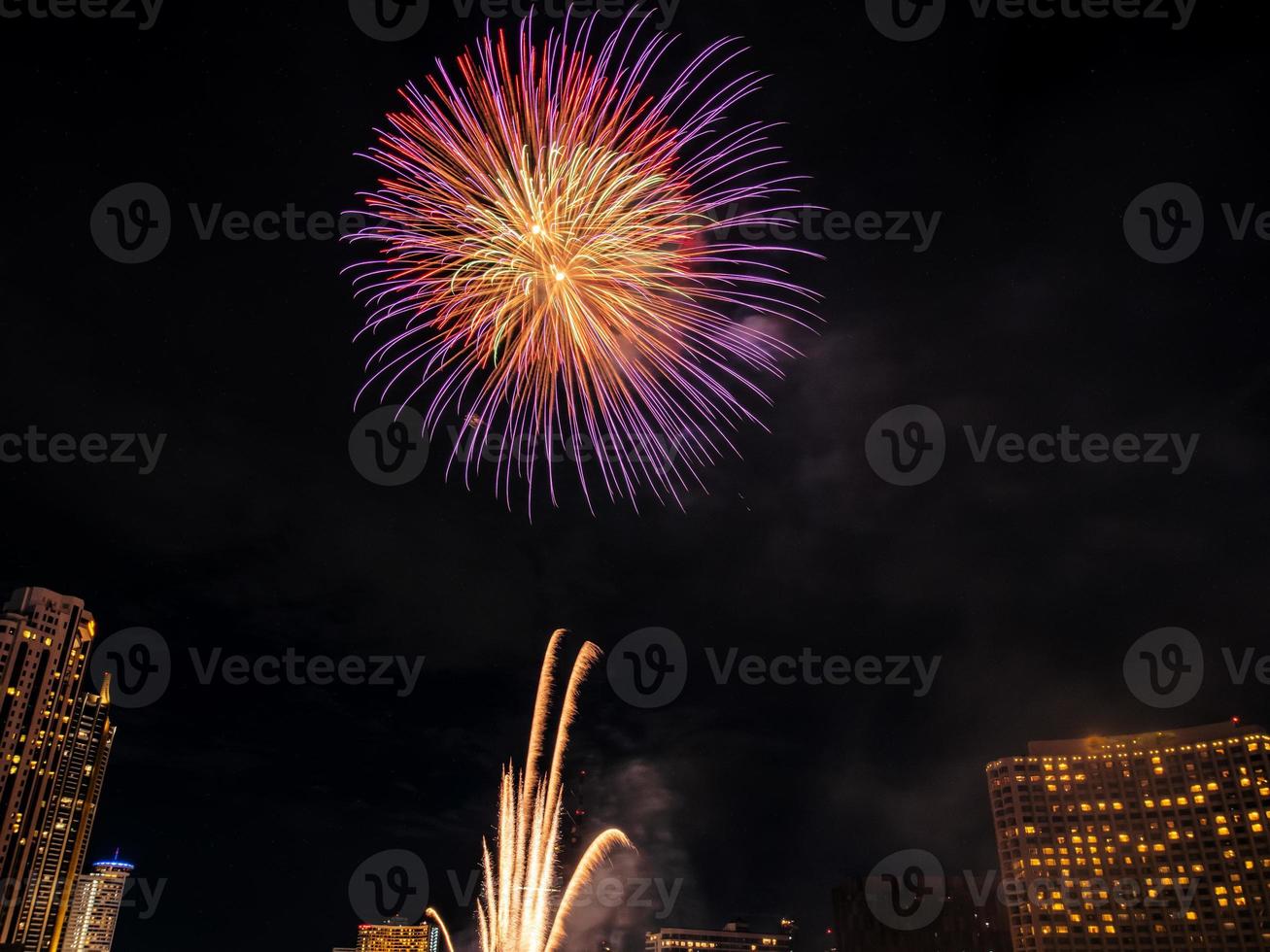 fireworks on the river in the dark sky photo