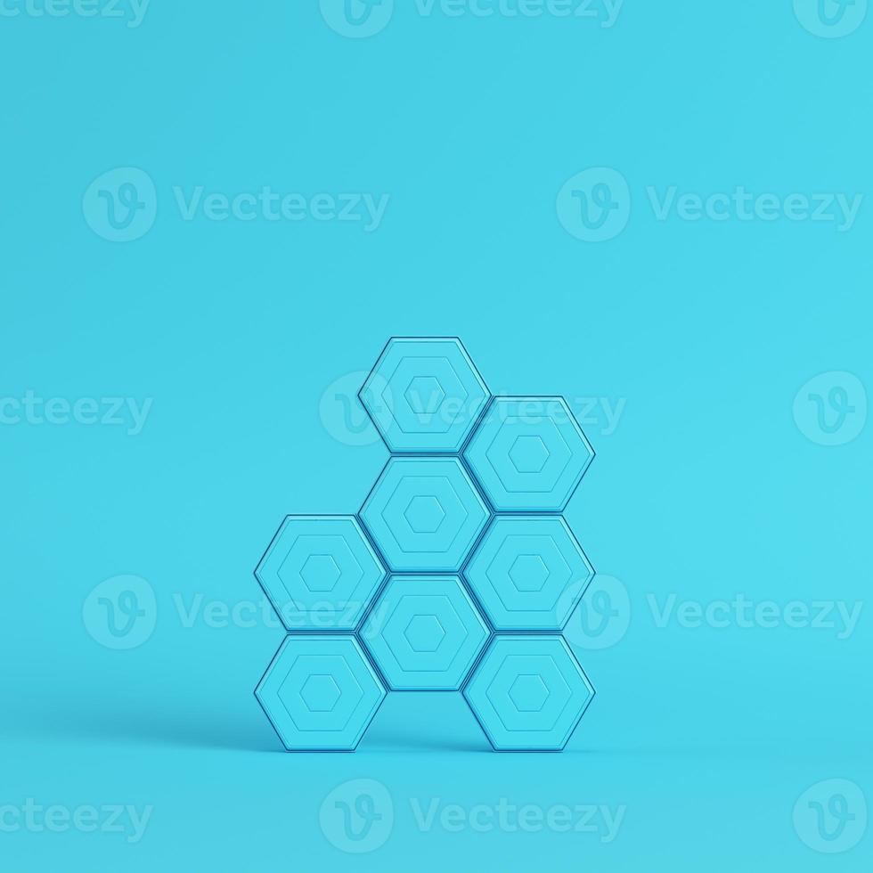Abstract hexagons on bright blue background in pastel colors photo