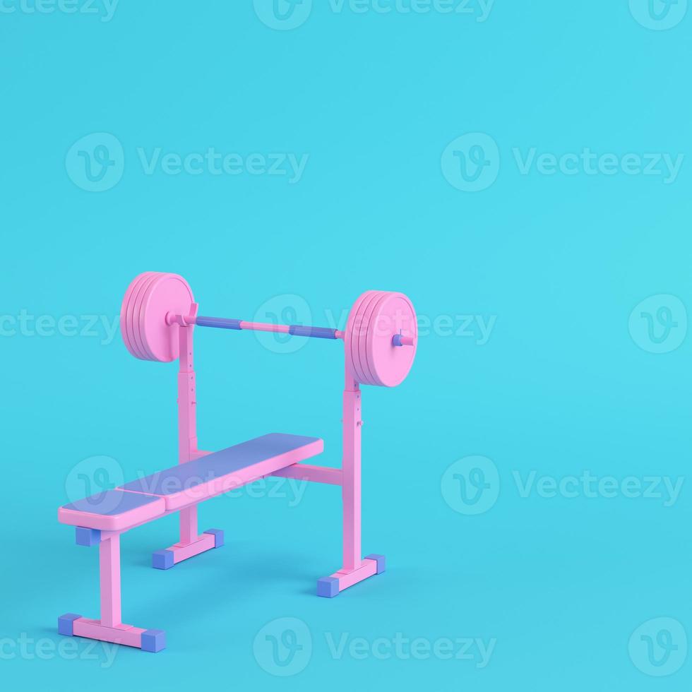 Pink barbell with bench on bright blue background in pastel colors. Minimalism concept photo