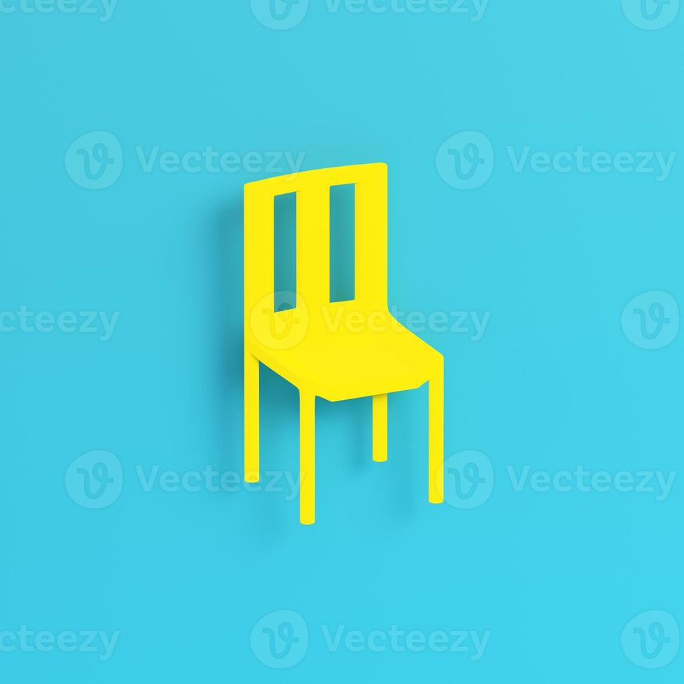 Yellow chair on bright blue background in pastel colors photo
