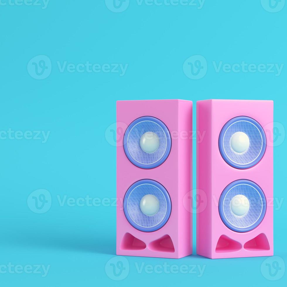 Pink stereo speakers on bright blue background in pastel colors photo