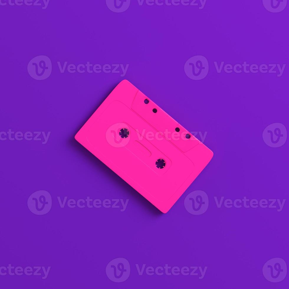Audio cassette tape cup on purple background. Minimalism concept photo