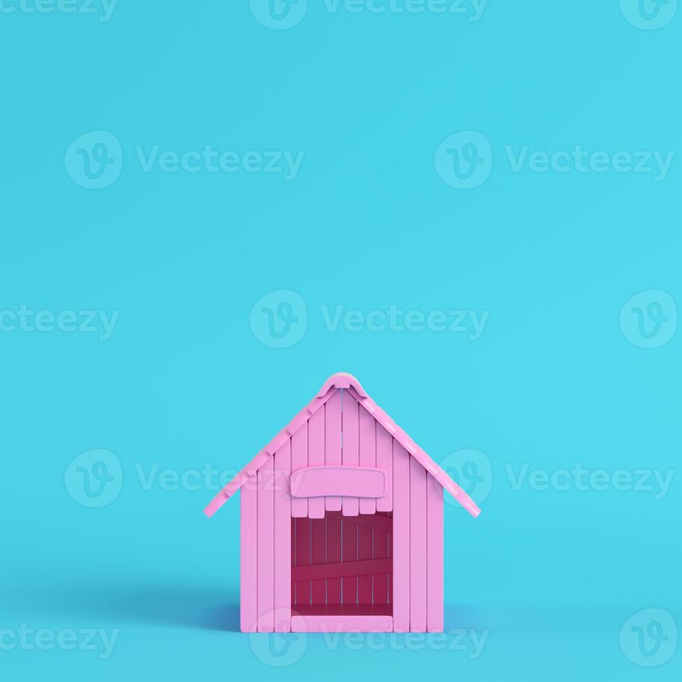 Pink doghouse on bright blue background in pastel colors photo