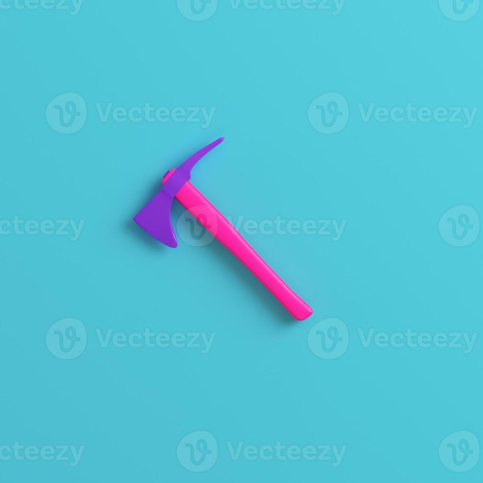 Pink axe on bright blue background. Minimalism concept photo
