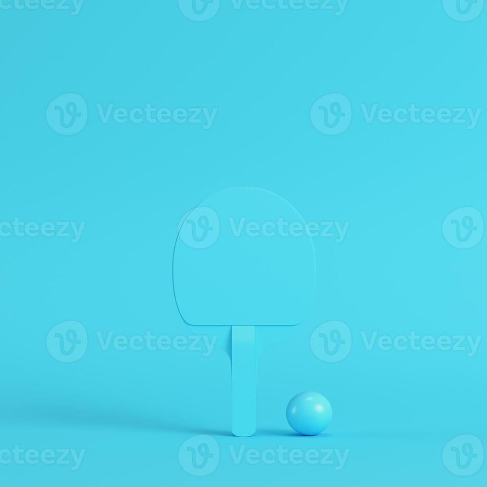 Ping pong racket with ball on bright blue background in pastel colors. Minimalism concept photo