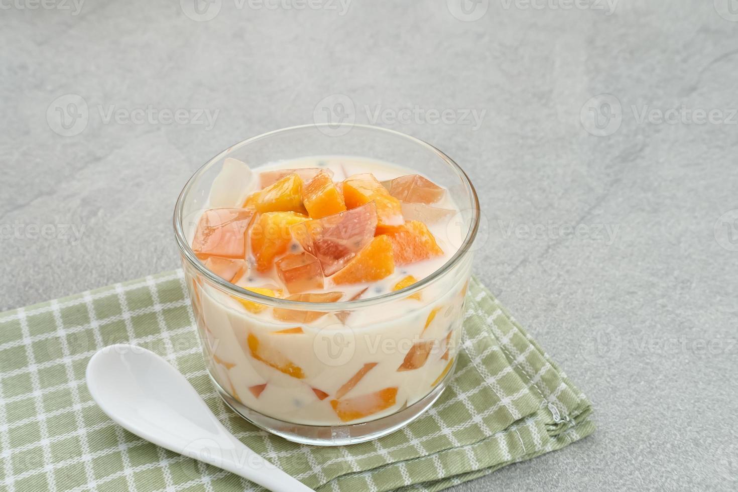 Mango Cheese Milk, a dessert made from jelly, nata de coco, basil seed, sweet mango, cream cheese and milk. photo