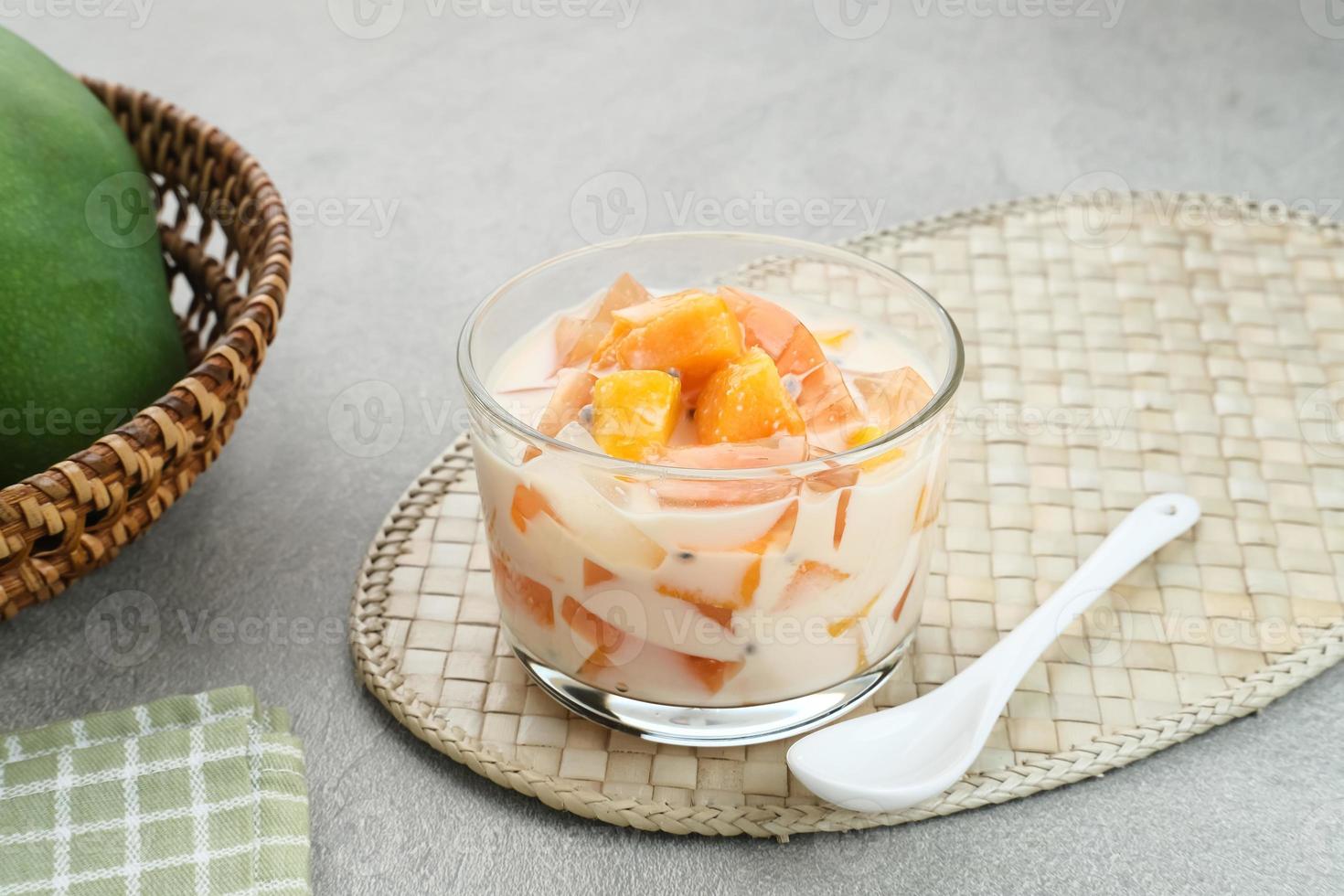 Mango Cheese Milk, a dessert made from jelly, nata de coco, basil seed, sweet mango, cream cheese and milk. photo