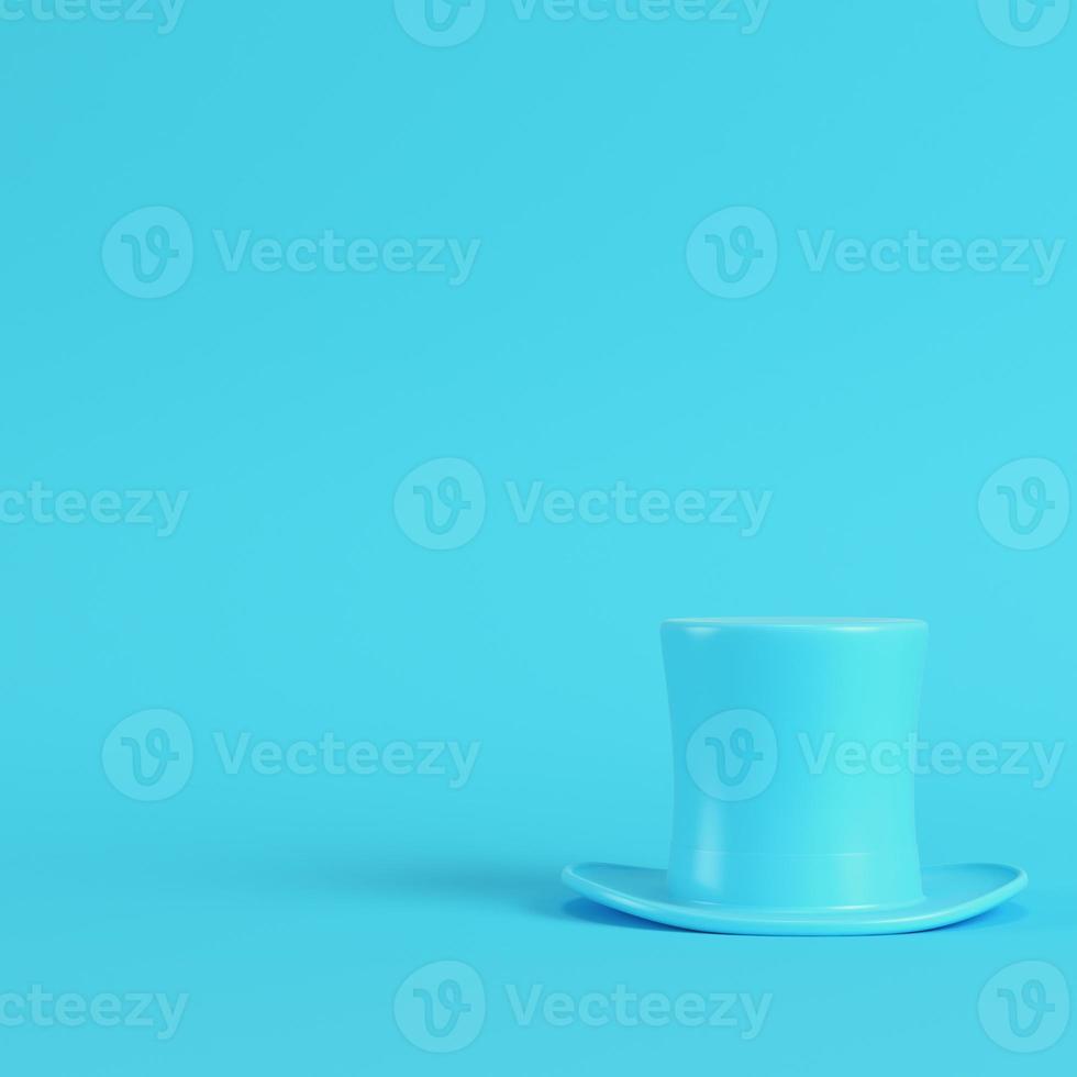 Top hat on bright blue background in pastel colors. Minimalism concept photo