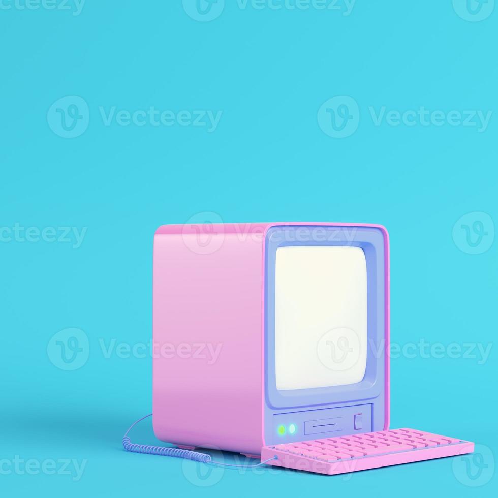 Pink retro computer on bright blue background in pastel colors photo