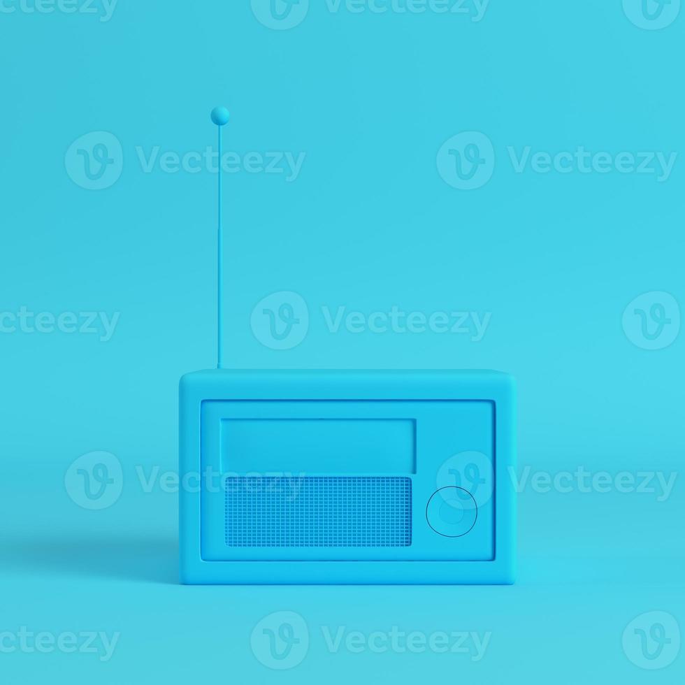 Retro styled radio on bright blue background in pastel colors photo